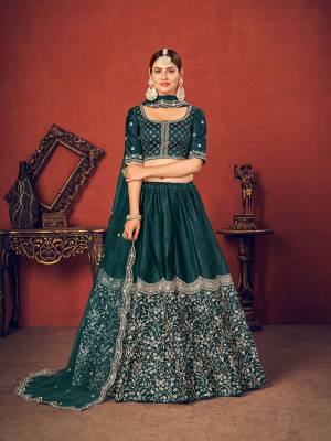 Garb This Wedding Partywear Heavy Designer Lehenga Choli And Dupatta In Fine Color Fabricated On Silk Beautified With Heavy Attractive Thread,Sequance Embroidery Work. 