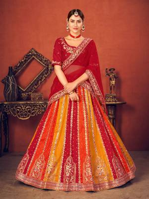 Garb This Wedding Partywear Heavy Designer Lehenga Choli And Dupatta In Fine Color Fabricated On Art Silk Beautified With Heavy Attractive Thread,Sequance Embroidery Work. 