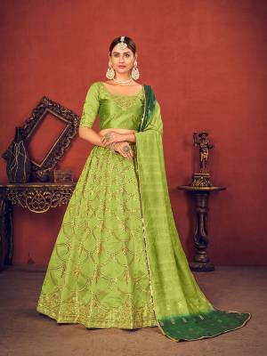 Garb This Wedding Partywear Heavy Designer Lehenga Choli And Dupatta In Fine Color Fabricated On Art Silk Beautified With Heavy Attractive Thread,Sequance Embroidery Work. 