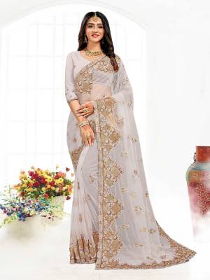 Looking This Partywear Saree Are Fine Saree Paired With Blouse.This Saree And Blouse Are Net Fabric With Heavy Designer Embroidery And Zarkan Stone Work. Buy This Pretty Saree Now.