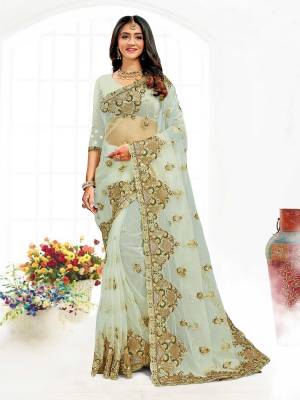 Looking This Partywear Saree Are Fine Saree Paired With Blouse.This Saree And Blouse Are Net Fabric With Heavy Designer Embroidery And Zarkan Stone Work. Buy This Pretty Saree Now.