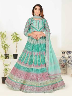 Look Attrective This Wedding Partywear Heavy Designer Lehenga Choli And Dupatta In Fine Light Color Fabricated On Georgette Beautified With Heavy Attractive Foil Mirror,Thread,Jari Embroidery Work. 