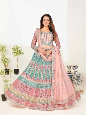 Look Attrective This Wedding Partywear Heavy Designer Lehenga Choli And Dupatta In Fine Light Color Fabricated On Georgette Beautified With Heavy Attractive Foil Mirror,Thread,Jari Embroidery Work. 