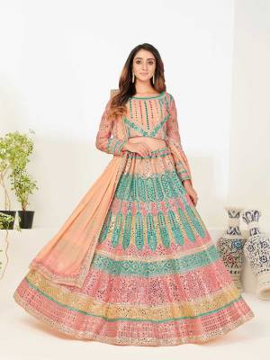 Look Attrective This Wedding Partywear Heavy Designer Lehenga Choli And Dupatta In Fine Light Color Fabricated On Georgette Beautified With Heavy Attractive Foil Mirror,Thread,Jari Embroidery Work. 