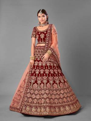 Look Attrective This Wedding Partywear Heavy Designer Lehenga Choli And Dupatta In Fine Color Fabricated On Velvet Beautified With Heavy Attractive Embroidery Work. Buy Now.