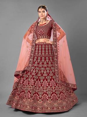 Look Attrective This Wedding Partywear Heavy Designer Lehenga Choli And Dupatta In Fine Color Fabricated On Velvet Beautified With Heavy Attractive Embroidery Work. Buy Now.