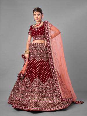 Look Attrective This Wedding Partywear Heavy Designer Lehenga Choli And Dupatta In Fine Color Fabricated On Velvet Beautified With Heavy Attractive Embroidery Work. Buy Now.