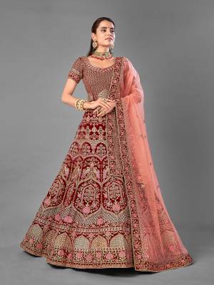 Look Attrective This Wedding Partywear Heavy Designer Lehenga Choli And Dupatta In Fine Color Fabricated On Velvet Beautified With Heavy Attractive Embroidery Work. Buy Now.