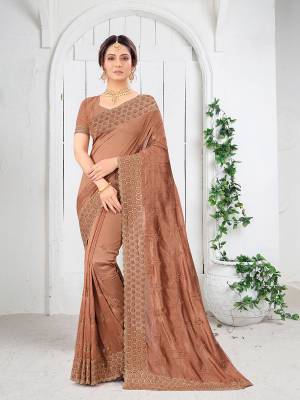 Garb This Partywear Saree Are Fine Saree Paired With Blouse.This Saree And Blouse Are Two Tone Vichitra Silk Fabric With Heavy Designer Embroidery And Border Stone Work. Buy This Pretty Saree Now.