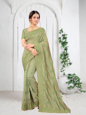 Garb This Partywear Saree Are Fine Saree Paired With Blouse.This Saree And Blouse Are Two Tone Vichitra Silk Fabric With Heavy Designer Embroidery And Border Stone Work. Buy This Pretty Saree Now.