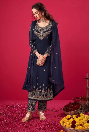 Garb This Designer Suit In Lovely Color.Its Pretty Heavy Designer Thread,Jari Embroidery Work Top Is Georgette Based Paired With Santoon Bottom And Naznin Fabricated Dupatta Which Gives An Attractive To The Suit.