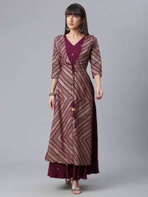 Attrective This Readymade Long Kurti In Fine Color Fabricated On Crepe Beautified With Designer Printed With Side Pocket. It Is Light In Weight And Easy To Carry All Day Long. 