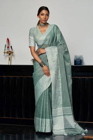 Garb This Traditional Saree Are Fine Saree Paired With Blouse.This Saree And Blouse Are Linen Based Fabric With Wevon Designer Pallu Border Work. Buy This Pretty Saree Now.