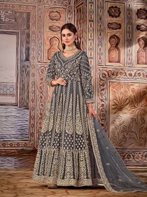 Stylist This Partywear Designer Long Length Suit In Lovely Color.Its Pretty Heavy Designer Embroidery Work Top Is Net Based Paired With Santoon Bottom And Net Fabricated Dupatta Which Gives An Attractive To The Suit.