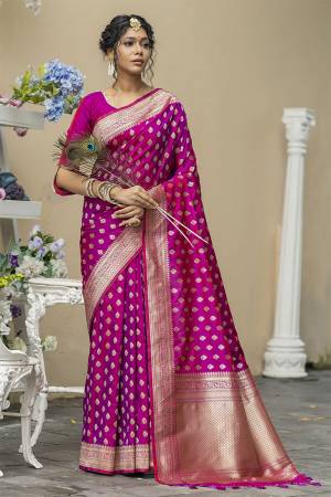 Stylist This Fastival Saree Are Fine Saree Paired With Blouse.This Saree And Blouse Are Banarasi Cotton Silk Based Fabric With Heavy Wevon Jari Designer Work.Buy This Pretty Saree Now.