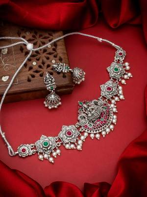 Heavy Looking To Your Personality By Pairing Up This Beautiful Necklace Set With Your Ethnic Attire. This Prtty Set Is In Silver Color Beautified With Temple Work. Buy Now.