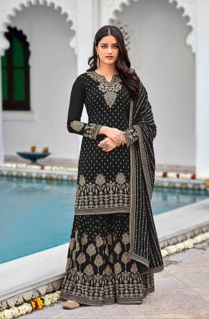 Attrective This Designer Pakistani Sharara Suit In Lovely Color.Its Pretty Heavy Designer Sequance Embroidery Work Top Is Faux Georgette Based Paired With Faux Georgette Bottom And Faux Georgette Fabricated Dupatta Which Gives An Attractive To The Suit.