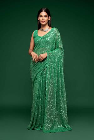 Partywear This Pretty Elegant Looking Designer Saree In Fine Color Paired With Blouse. This Saree And Blouse Are Georgette Based Beautified With Heavy Designer Sequance Embroidery Work With Blouse Work. Buy Now.