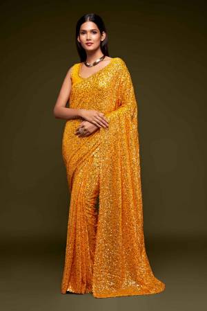 Partywear This Pretty Elegant Looking Designer Saree In Fine Color Paired With Blouse. This Saree And Blouse Are Georgette Based Beautified With Heavy Designer Sequance Embroidery Work With Blouse Work. Buy Now.