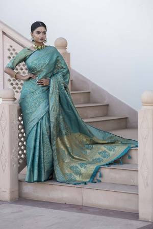 Garb This Designer Partywear Saree Are Fine Saree Paired With Blouse.This Saree And Blouse Are Kanchipuram Silk Based Fabric With Heavy Wevon Designer Work. Buy This Pretty Saree Now.