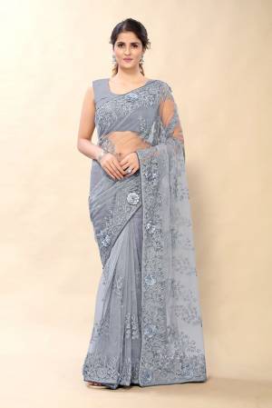 Looking This Partywear Saree Are Fine Saree Paired With Blouse.This Saree And Blouse Are Net Fabric With Heavy Designer Embroidery With Stone Work. Buy This Pretty Saree Now.