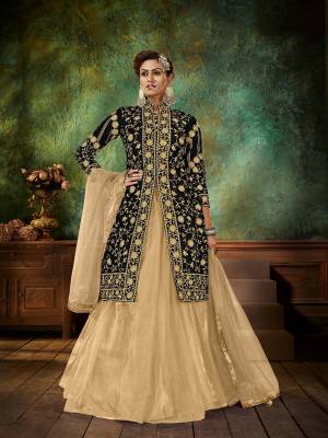 Attrective This Designer Long Length Skirt Suit In Lovely Color.Its Pretty Heavy Designer Embroidery With Stone Work Top Is Velvet Based Paired With Net Bottom And Net Fabricated Dupatta Which Gives An Attractive To The Suit.