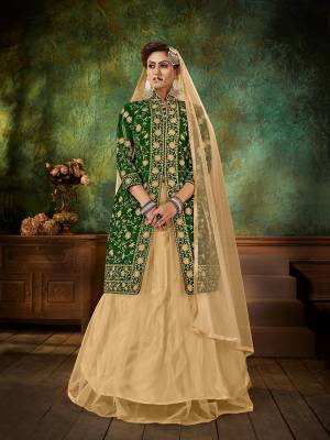 Attrective This Designer Long Length Skirt Suit In Lovely Color.Its Pretty Heavy Designer Embroidery With Stone Work Top Is Velvet Based Paired With Net Bottom And Net Fabricated Dupatta Which Gives An Attractive To The Suit.