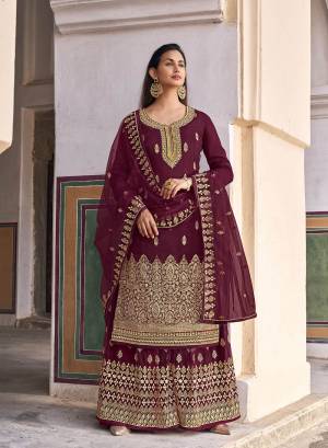 Looking This Designer Plazzo Suits In Lovely Color.Its Pretty Designer Wevon With Embroidery And Stone Work Top Is Dola Jacquard Based Paired Bottom Net With Net Fabricated Dupatta Which Gives An Attractive To The Dress.