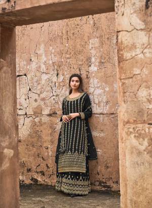 Looking This Designer Plazzo Suits In Lovely Color.Its Pretty Designer Wevon With Embroidery And Stone Work Top Is Dola Jacquard Based Paired Bottom Net With Net Fabricated Dupatta Which Gives An Attractive To The Dress.