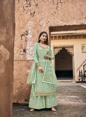 Looking This Designer Plazzo Suits In Lovely Color.Its Pretty Designer Wevon With Embroidery And Stone Work Top Is Dola Jacquard Based Paired Bottom Net With Net Fabricated Dupatta Which Gives An Attractive To The Dress.