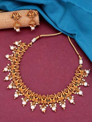 Attrective Traditional Looking To Your Personality By Pairing Up This Beautiful Nacklace With Your Ethnic Attire. This Pretty Set Is In Gold Color Beautified With Temple Work. Buy Now.