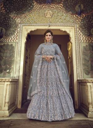 Garb This Partywear Heavy Designer Lehenga Choli In Fine Light Color Fabricated On Soft Net Beautified Fabric With Heavy Designer Sequance,Thread,Jari,Dori Embroidery Work.Buy Now. 