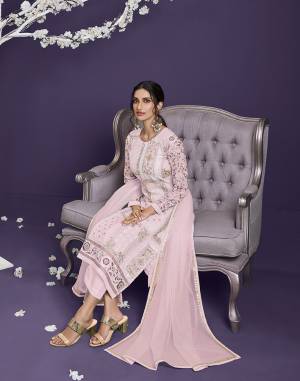 Attrective This Designer Long Length Suit In Lovely Light Color.Its Pretty Heavy Designer Thread,Jari,Sequance Embroidery Work Top Is Georgette Based Paired With Dull Santoon Bottom And Net Fabricated Dupatta Which Gives An Attractive To The Suit.