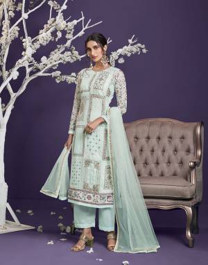 Attrective This Designer Long Length Suit In Lovely Light Color.Its Pretty Heavy Designer Thread,Jari,Sequance Embroidery Work Top Is Georgette Based Paired With Dull Santoon Bottom And Net Fabricated Dupatta Which Gives An Attractive To The Suit.