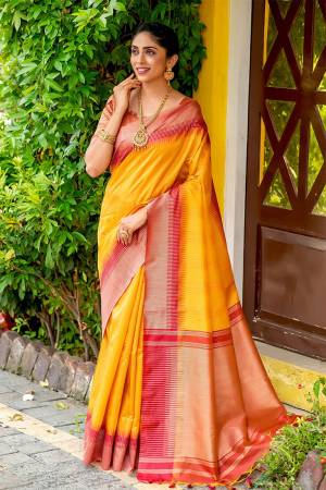 Classic Designer Partywear Saree Are Fine Color Paired With Blouse.This Saree And Blouse Are South Cotton Based Fabric With Heavy Wevon Jari And Temple Pallu Border Tassels Designer. Buy This Pretty Saree Now.