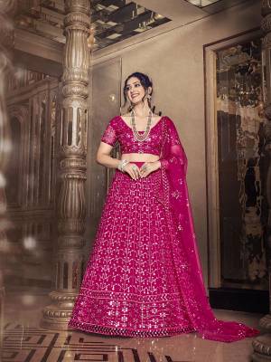 Garb This Partywear Special Designer Lehenga Choli And Dupatta In Dark Color. Blouse,Lahenga And Dupatta Are Soft Net Beautified Fabric With Heavy Thread,Sequance Embroidery Work.Buy Now. 