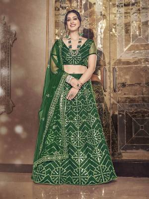 Garb This Partywear Special Designer Lehenga Choli And Dupatta In Dark Color. Blouse,Lahenga And Dupatta Are Soft Net Beautified Fabric With Heavy Thread,Sequance Embroidery Work.Buy Now. 