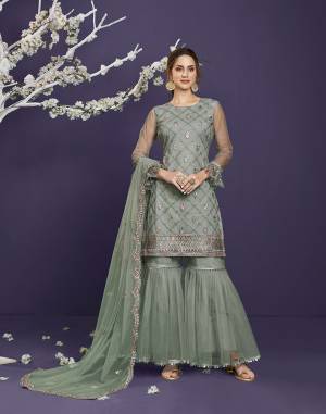 Attrective This Designer Long Length Sharara Suit In Lovely Light Color.Its Pretty Heavy Designer Thread,Sequance Embroidery Work Top Is Butterfly Net Based Paired With Butterfly Net Bottom And Butterfly Net Fabricated Dupatta Which Gives An Attractive To The Suit.Buy Now.