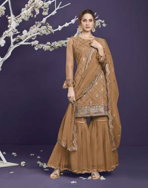 Attrective This Designer Long Length Sharara Suit In Lovely Light Color.Its Pretty Heavy Designer Thread,Sequance Embroidery Work Top Is Butterfly Net Based Paired With Butterfly Net Bottom And Butterfly Net Fabricated Dupatta Which Gives An Attractive To The Suit.Buy Now.