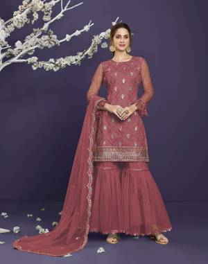 Attrective This Designer Long Length Sharara Suit In Lovely Light Color.Its Pretty Heavy Designer Thread,Sequance Embroidery Work Top Is Butterfly Net Based Paired With Butterfly Net Bottom And Butterfly Net Fabricated Dupatta Which Gives An Attractive To The Suit.Buy Now.