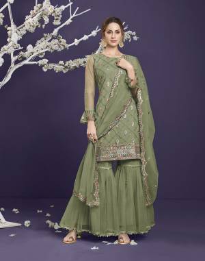 Attrective This Designer Long Length Sharara Suit In Lovely Light Color.Its Pretty Heavy Designer Thread,Sequance Embroidery Work Top Is Butterfly Net Based Paired With Butterfly Net Bottom And Butterfly Net Fabricated Dupatta Which Gives An Attractive To The Suit.Buy Now.