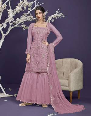 Attrective This Designer Long Length Sharara Suit In Lovely Light Color.Its Pretty Heavy Designer Thread,Sequance Embroidery Work Top Is Butterfly Net Based Paired With Butterfly Net Bottom And Butterfly Net Fabricated Dupatta Which Gives An Attractive To The Suit.Buy Now.