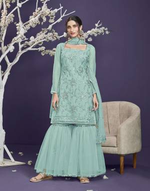 Attrective This Designer Long Length Sharara Suit In Lovely Light Color.Its Pretty Heavy Designer Thread,Sequance Embroidery Work Top Is Butterfly Net Based Paired With Butterfly Net Bottom And Butterfly Net Fabricated Dupatta Which Gives An Attractive To The Suit.Buy Now.