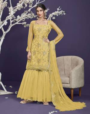 Attrective This Designer Long Length Sharara Suit In Lovely Light Color.Its Pretty Heavy Designer Thread,Sequance Embroidery Work Top Is Butterfly Net Based Paired With Butterfly Net Bottom And Butterfly Net Fabricated Dupatta Which Gives An Attractive To The Suit.Buy Now.