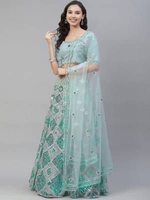 Attrective Bridal Partywear Heavy Designer Lehenga Choli And Dupatta In Blue Color Fabricated On Net Beautified With Heavy Attractive Seaqoance Embroidery Work. 