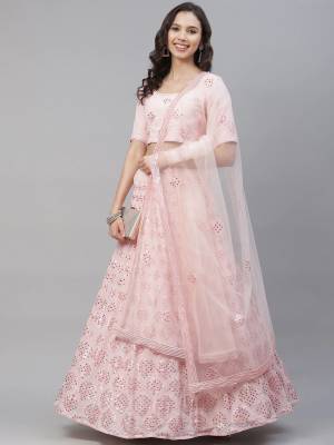 Attrective Bridal Partywear Heavy Designer Lehenga Choli In Light Color Fabricated On Georgette Beautified And Dupatta Are Net With Heavy Attractive Seaqoance Embroidery Work. 