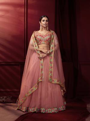 This Wedding Season, Be The Most Attractive Wearing This Heavy Designer Lehenga?Choli In Beautifull Colored Paired With Pretty Blouse And Dupatta. Its Blouse And Lehenga Are Net With Satin Based Paired With Net Fabricated Dupatta.Grab This lovely Collection Now