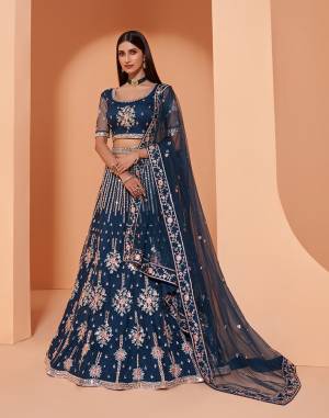 Garb This Designer Wedding Lehenga Choli With Belt In Fine Color Fabricated On Net Beautified Fabric Lahenga Choli With Designer Heavy Thread, Sequance,Coading,Badla Embroidery With Zarkan,Mirror Work.Buy Now. 