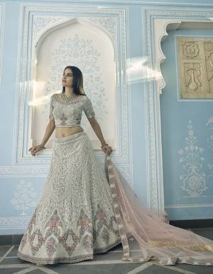 Garb This Wedding Partywear Heavy Designer Lehenga Choli In Fine Light Color Fabricated On Georgette Beautified Fabric With Heavy Designer Embroidery Work.Buy Now. 