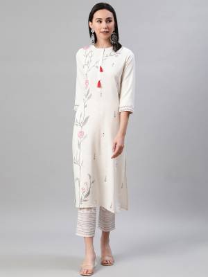 Looking This Readymade Long Kurti With Bottom In Fine Color. This Kurti And Pant Are Fabricated On Rayon Beautified With Designer Foil Printed. It Is Light In Weight And Easy To Carry All Day Long. 